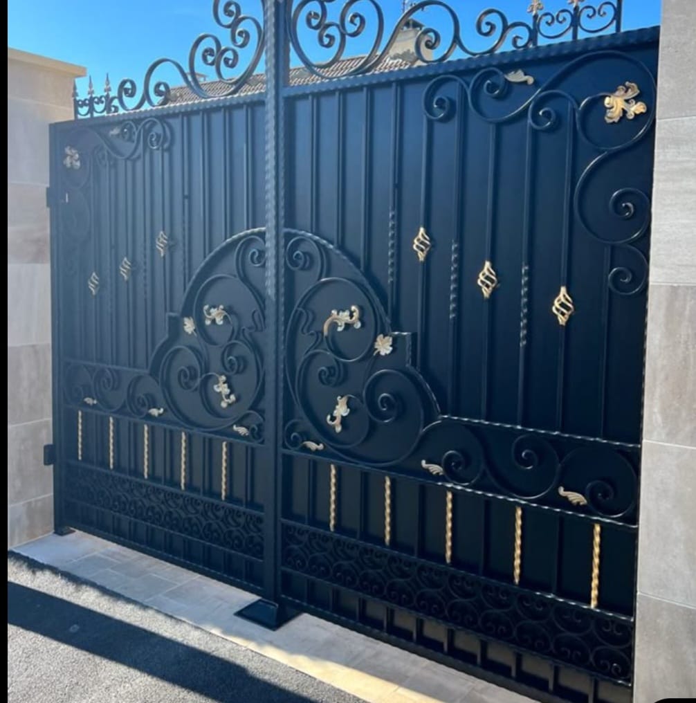 Decorative steel gate with gold accents